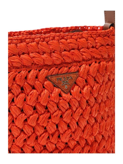 Shop Prada Woven Logo Bucket Bag In Orange