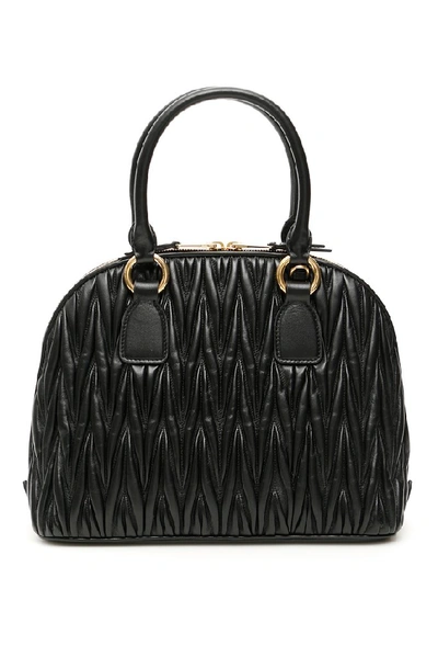 Shop Miu Miu Matelassé Logo Top Handle Tote Bag In Black