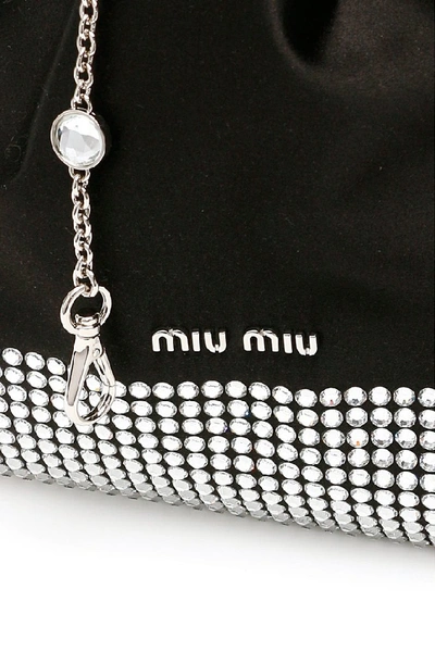 Shop Miu Miu Crystal Embellished Drawstring Pouch In Black