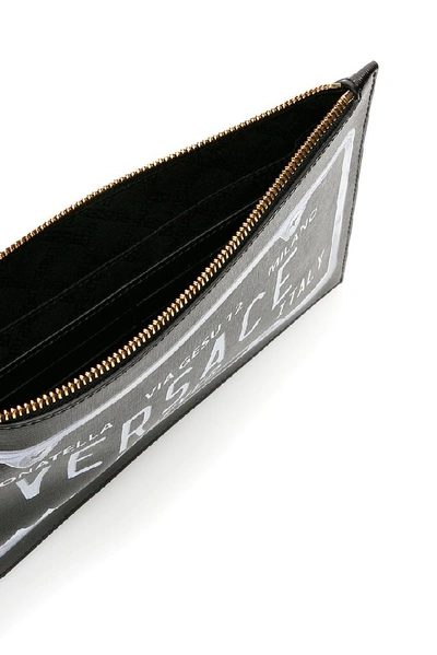 Shop Versace Logo Motif Clutch Bag In Black