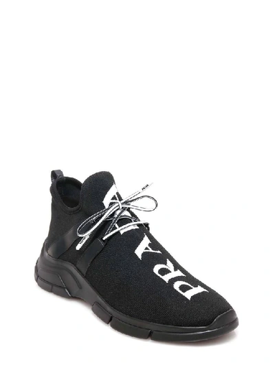 Shop Prada Logo Knit Sneakers In Black