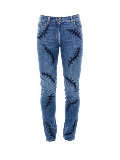 Shop Moschino Embroidered Denim Jeans In Blue