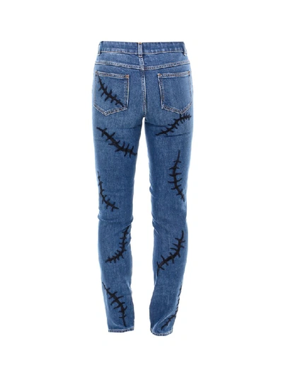 Shop Moschino Embroidered Denim Jeans In Blue