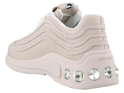 Shop Miu Miu Crystal Embellished Low Top Sneakers In Pink