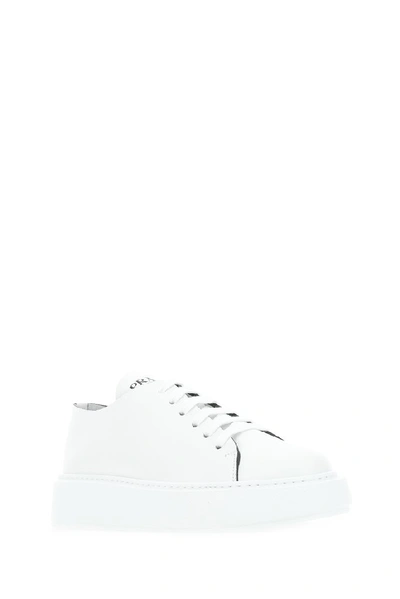Shop Prada Contrast Logo Sneakers In White