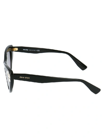 Shop Miu Miu Eyewear Embellished Cat Eye Frame Sunglasses In Black