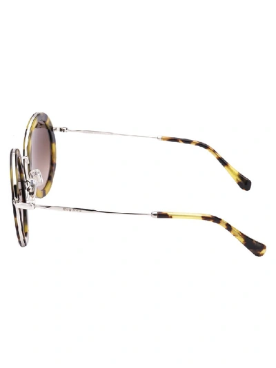 Shop Miu Miu Eyewear Round Frame Sunglasses In Brown