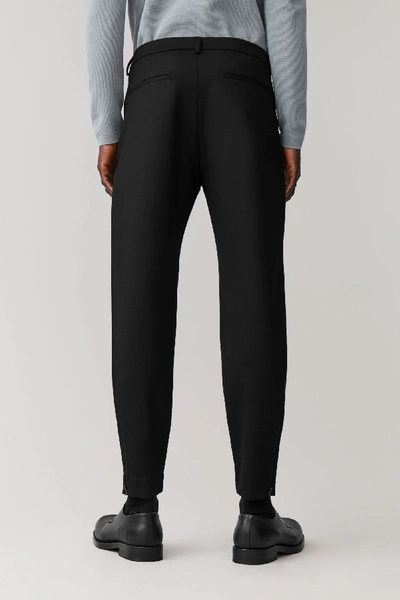 Shop Cos Slim-fit Zipped Hem Pants In Black