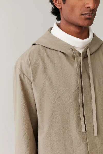 Shop Cos Lightweight Hooded Jacket In Brown