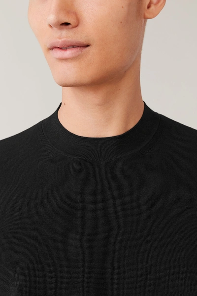 Shop Cos Mock-neck Knitted Sweater In Black