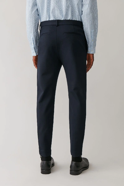 Shop Cos Slim-fit Zipped Hem Trousers In Blue