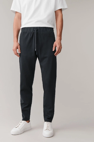 Shop Cos Regular-fit Drawstring Joggers In Blue