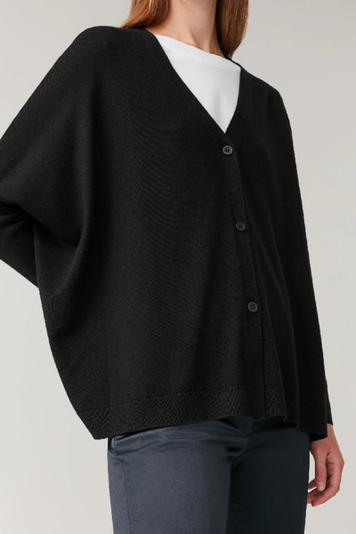 Shop Cos Knitted Wool Cardigan In Black