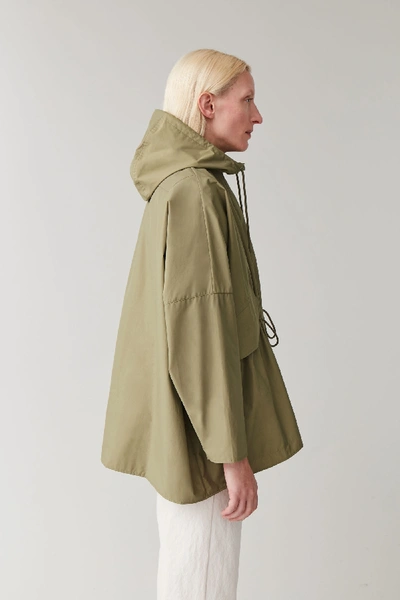 Shop Cos Light Packable Raincoat In Green