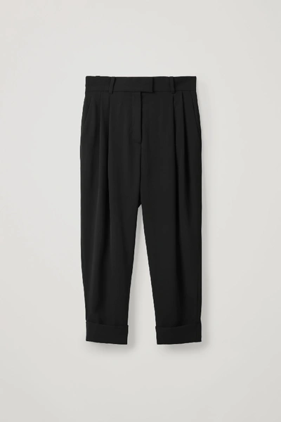 Shop Cos Dropped Crotch Trousers With Pleats In Black