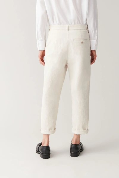 Shop Cos Relaxed Button-up Chinos In Beige