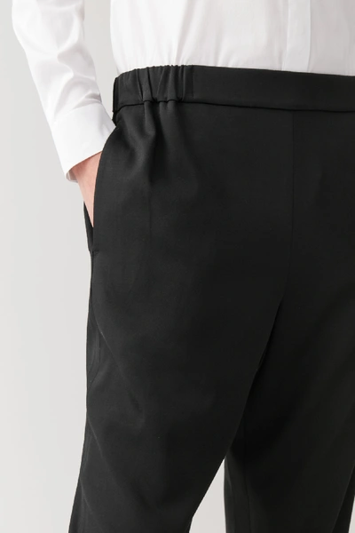 Shop Cos Elasticated Wool-mix Pants In Black