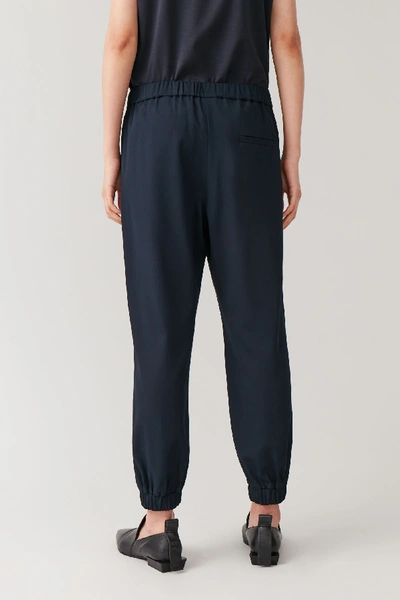 Shop Cos Elasticated Wool-mix Trousers In Blue