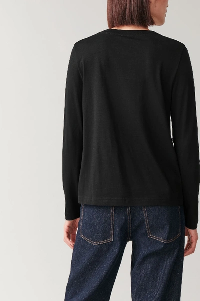 Shop Cos Long-sleeved Cotton Top In Black