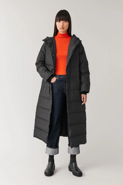 Shop Cos Hooded Long Puffer Coat In Black