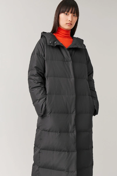 Shop Cos Hooded Long Puffer Coat In Black