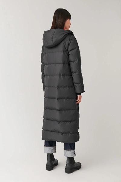 Shop Cos Hooded Long Puffer Coat In Black