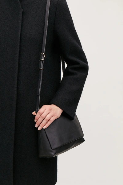 Shop Cos Small Soft-leather Shoulder Bag In Black