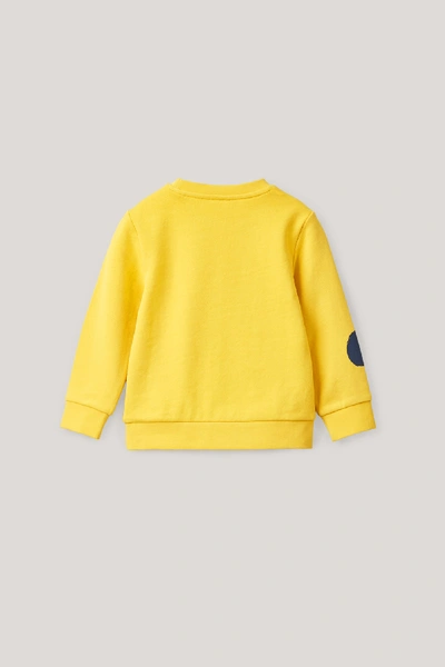 Shop Cos Dot-printed Cotton Sweatshirt In Yellow