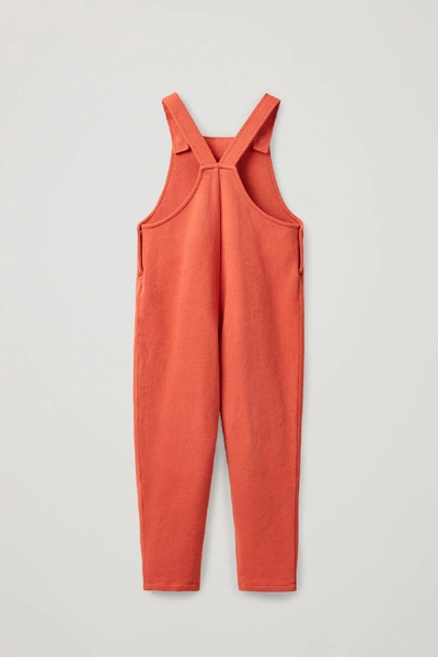 Shop Cos Cotton Jersey Dungarees In Orange
