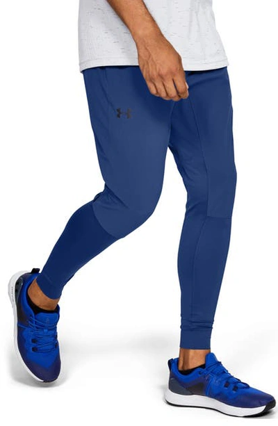 Shop Under Armour Hybrid Water Repellent Performance Training Pants In American Blue/ Black
