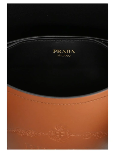 Shop Prada City Bucket Bag In Brown