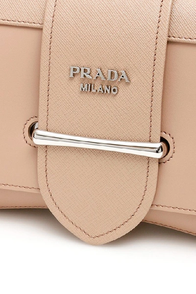 Shop Prada Sidonie Buckled Shoulder Bag In Beige