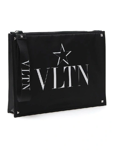 Shop Valentino Garavani Vltn Star Printed Clutch Bag In Black