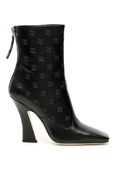 Shop Fendi Logo Embossed Ankle Boots In Black