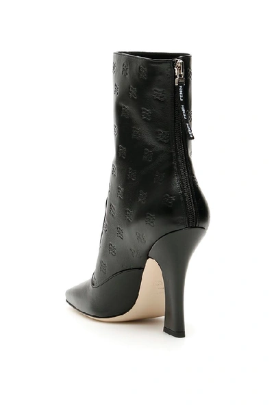 Shop Fendi Logo Embossed Ankle Boots In Black