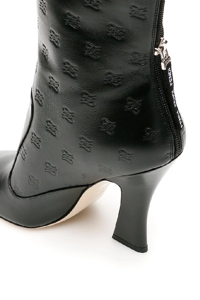 Shop Fendi Logo Embossed Ankle Boots In Black