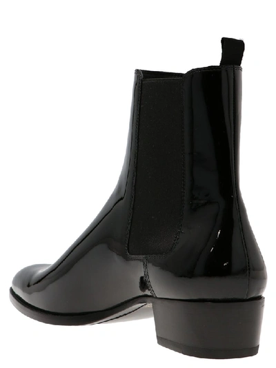 Shop Saint Laurent Wyatt Ankle Boots In Black