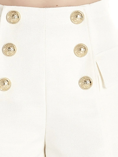 Shop Balmain High Waisted Buttoned Flap Shorts In White