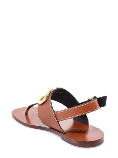 Shop Valentino Vlogo Thong Sandals In Brown