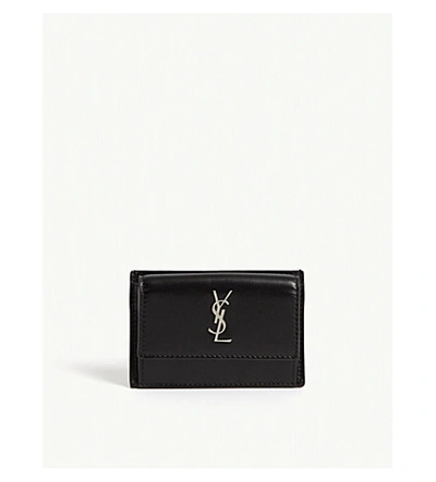 Shop Saint Laurent Logo Leather Flap Wallet In Black