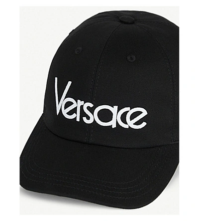 Shop Versace Logo-embroidered Cotton Baseball Cap In Black