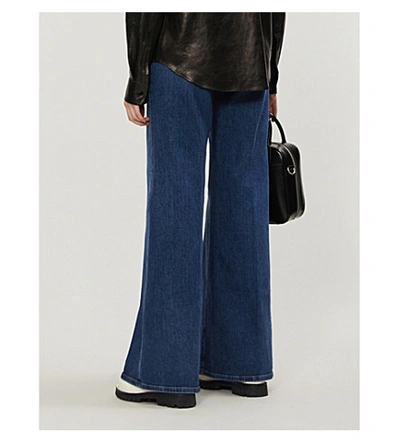 Shop Frame Le Palazzo Flared High-rise Jeans In Darby