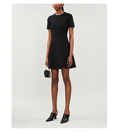 Shop Theory Flared Stretch-knit Mini Dress In Black
