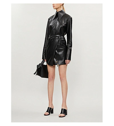Shop Nanushka Seyoka Wrap-front Vegan Leather Mini Skirt In Black