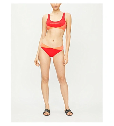 Shop Calvin Klein Logo-print Colour-block Bikini Bottoms In Xa7 Fiery Red