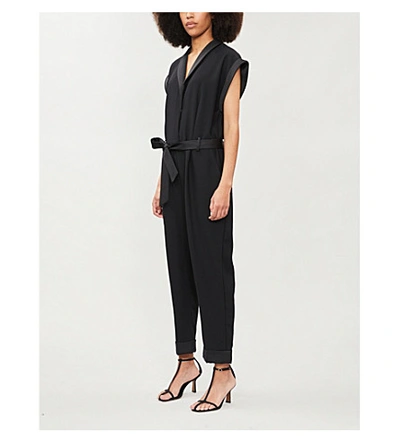 Shop Frame Wrap-over Crepe Jumpsuit In Noir