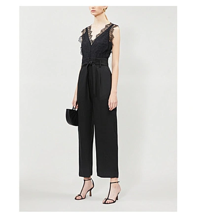 Shop Sandro Floral Lace And Gabardine Jumpsuit In Black