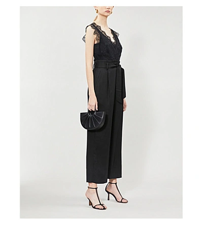 Shop Sandro Floral Lace And Gabardine Jumpsuit In Black