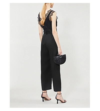 Shop Sandro Floral Lace And Gabardine Jumpsuit In Black