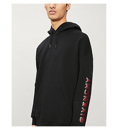 Shop Givenchy Flocked Brand-print Cotton-blend Jersey Hoody In Black